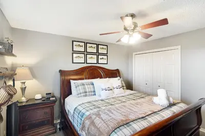 a bedroom with a bed and a ceiling fan at The Tree House in Evergreen