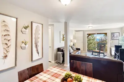 a living room with a couch and a table at The Tree House in Evergreen