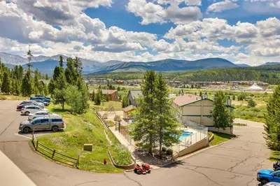 an aerial view of a town with mountains in the background at Fraser Condo Rental with Balcony, Mountain Views! in Fraser