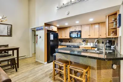 a kitchen with a sink and a counter top at Keystone Condo on Shuttle Line Less Than 1 Mi to Resort! in Dillon