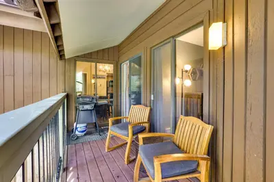 a porch with two chairs and a table on it at Keystone Condo on Shuttle Line Less Than 1 Mi to Resort! in Dillon