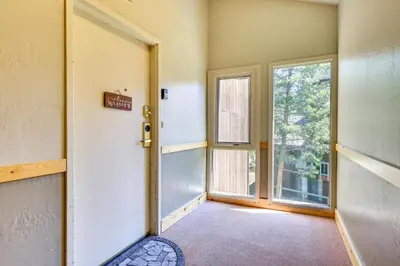 an empty room with a door and a window at Keystone Condo on Shuttle Line Less Than 1 Mi to Resort! in Dillon