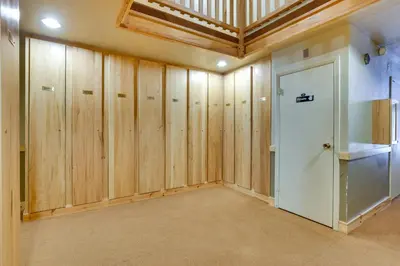 a large room with wooden walls and a door at Keystone Condo on Shuttle Line Less Than 1 Mi to Resort! in Dillon