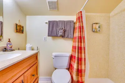 a bathroom with a toilet and a shower at Family-Friendly Fraser Condo with Heated Pool Access in Fraser
