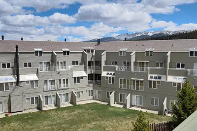 a large apartment building with a yard at Guest Suite Downtown Winter Park GREAT LOCATION in Winter Park
