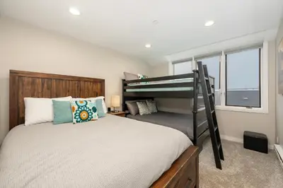 a bedroom with a bunk bed and a window at Great Location! Downtown WP with Hot Tub! Sleeps 6! in Winter Park