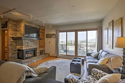 a living room with a couch and a fireplace at Great Location! Downtown WP with Hot Tub! Sleeps 6! in Winter Park