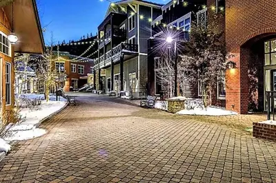 a cobblestone street in a town with buildings at Ski-In / Ski-Out Studio Condo at the base of Winter Park in Winter Park