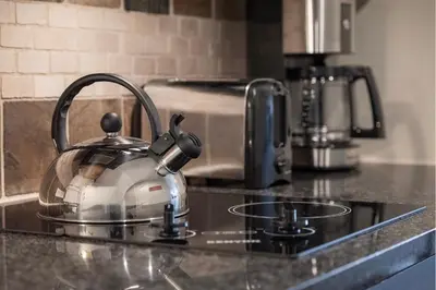 a tea kettle sitting on top of a kitchen counter at Ski-In / Ski-Out Studio Condo at the base of Winter Park in Winter Park