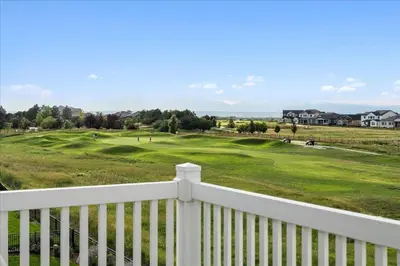 a view of the golf course from the balcony of a house at The Retreat at Buffalo Run Golf Course - Commerce City in Henderson