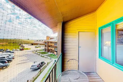 a balcony with a view of a parking lot at Silver Lodge B in Granby