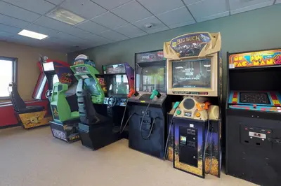 a room with arcade games and video game consoles at Silver Lodge B in Granby