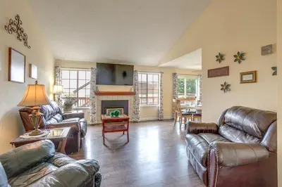 a living room with leather furniture and a fireplace at Grill, Fireplace and Fenced-In Yard Thornton Home! in Thornton