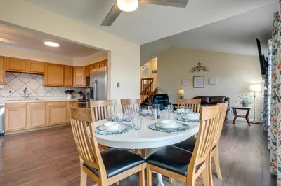 a kitchen and dining room with a table and chairs at Grill, Fireplace and Fenced-In Yard Thornton Home! in Thornton