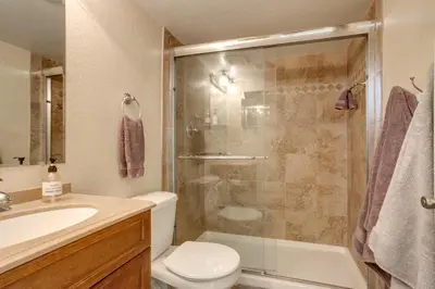 a bathroom with a shower and a toilet and a sink at Grill, Fireplace and Fenced-In Yard Thornton Home! in Thornton