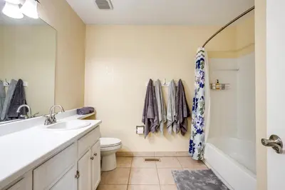 a bathroom with a sink and a toilet and a shower at Grill, Fireplace and Fenced-In Yard Thornton Home! in Thornton