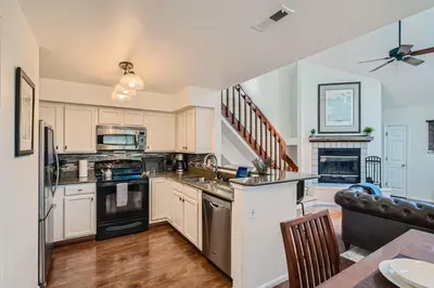 a kitchen with a sink and a stove at 4044 S Carson St Unit B - Aurora in Aurora