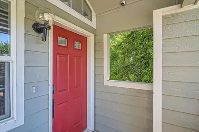 a red door on a house with a window at 4044 S Carson St Unit B - Aurora in Aurora