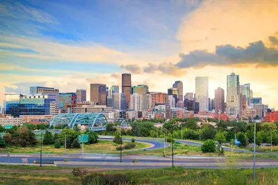 a city skyline with a highway in the foreground at 4044 S Carson St Unit B - Aurora in Aurora