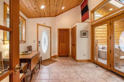a home office with a desk and a wooden ceiling at Kittery West - Monthly Long-Term Vacation Rental Only home in Estes Park
