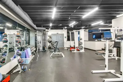 a gym with machines and equipment in a room at Ski-InandSki-Out, Scenic Mtn Views Granby Retreat! in Granby