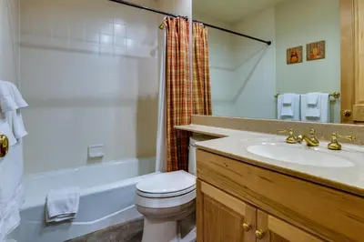 a bathroom with a sink and a toilet and a shower at Walk to Ski Lifts Townhome with Hot Tub in Keystone in Keystone