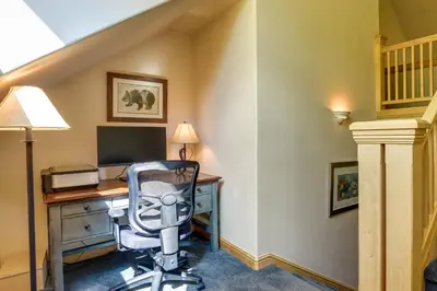an office with a desk with a computer and a chair at Walk to Ski Lifts Townhome with Hot Tub in Keystone in Keystone