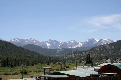 a view of a mountain range with snow covered mountains at Lazy R Cottages- 18 cabin in Estes Park