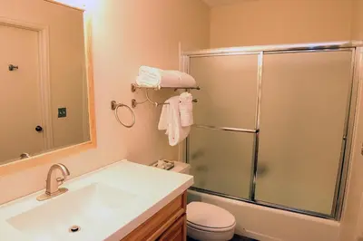 a bathroom with a shower and a sink and a toilet at Fawn Valley Inn- 277 condo in Estes Park
