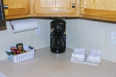 a coffee maker sitting on top of a kitchen counter at Fawn Valley Inn- 256 apts in Estes Park