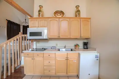 a kitchen with a sink and a microwave at Sunnyside Knoll- 19 apts in Estes Park