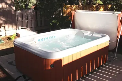 a hot tub sitting on the side of a yard at Sunnyside Knoll- 11 apts in Estes Park