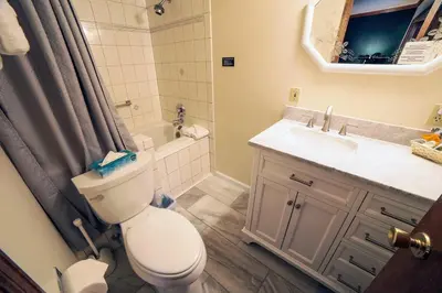 a bathroom with a toilet and a sink at Sunnyside Knoll- 2 cottage in Estes Park
