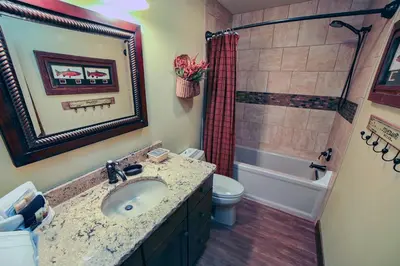 a bathroom with a sink and a toilet and a shower at Fawn Valley Inn- 269 condo in Estes Park