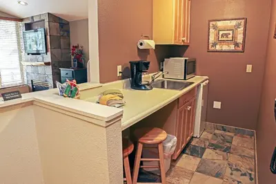 a kitchen with a sink and a counter top at Fawn Valley Inn- 105 condo in Estes Park