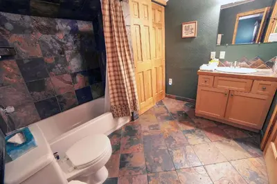a bathroom with a toilet and a sink at Fawn Valley Inn- 279 condo in Estes Park