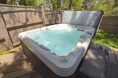 a hot tub sitting on top of a deck at Sunnyside Knoll- 14 studio in Estes Park