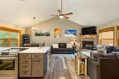 a kitchen and living room with a couch at 24 Snake River Village Townhomes condo in Keystone
