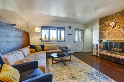 a living room with a couch and a fireplace at Winter Park Condo with Private Balcony Near Skiing! in Winter Park
