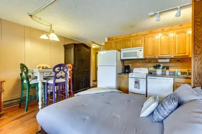 a kitchen with a large bed in a room at 2 Mi to Granby Ranch Granby Vacation Rental! in Granby