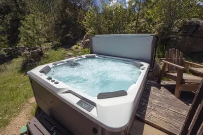 a hot tub with a spider sitting in it at Sunnyside Knoll- 17 cabin in Estes Park