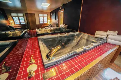 a large tub in the middle of a bathroom at Sunnyside Knoll- 5 cabin in Estes Park