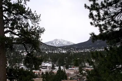 a view of a town with a mountain in the background at Lazy R Cottages- 5 cabin in Estes Park