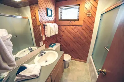 a bathroom with a sink and a toilet at Sunnyside Knoll- 8 cabin in Estes Park