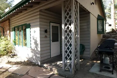 a front door of a house with a white door at Sunnyside Knoll- 8 cabin in Estes Park