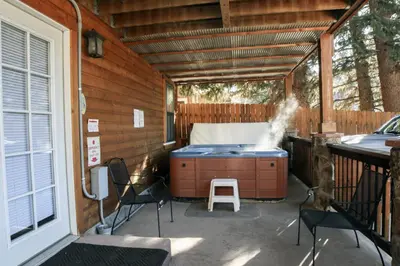 a screened in porch with a kitchen with a grill at Lawn Lane A - #3382 in Estes Park