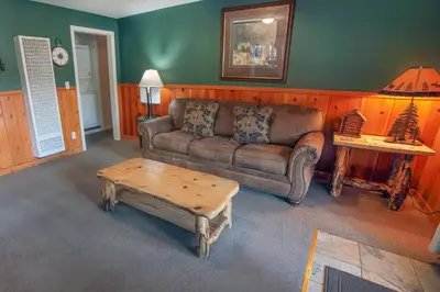 a living room with a couch and a coffee table at Lawn Lane A - #3382 in Estes Park