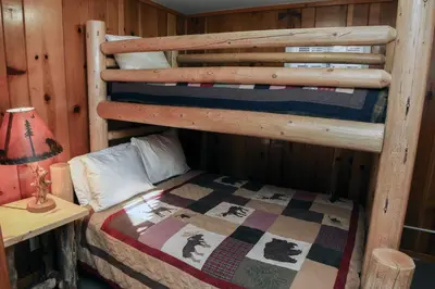a bedroom with a bunk bed in a cabin at Lawn Lane A - #3382 in Estes Park