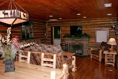 a living room with a couch and a fireplace at Triple R Cottages- 8 cabin in Estes Park