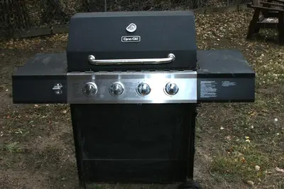 a black stove with a box on top of it at Lazy R Cottages- 1 apts in Estes Park